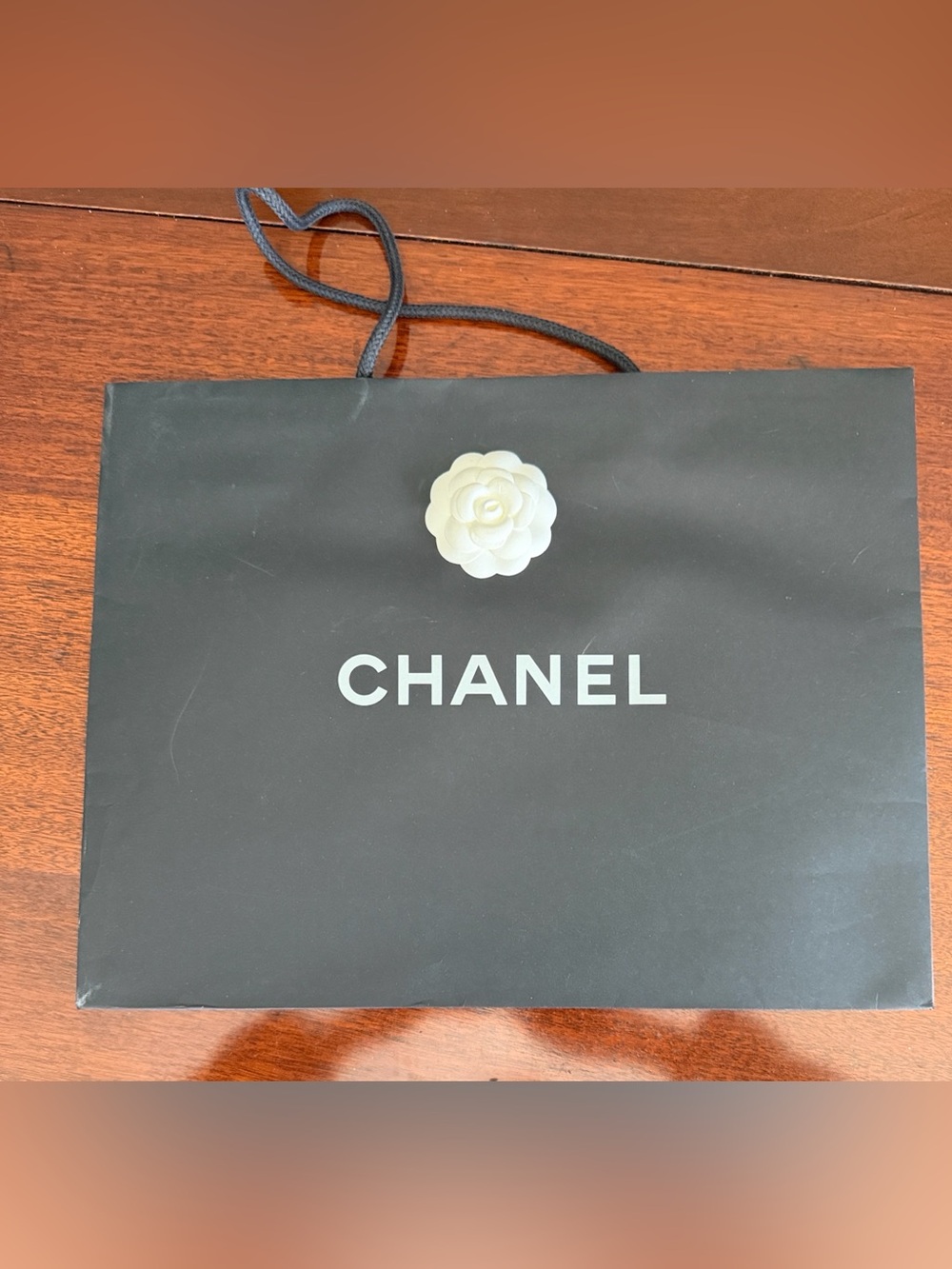 CHANEL Black Shopping Bag with White Camellia Accent